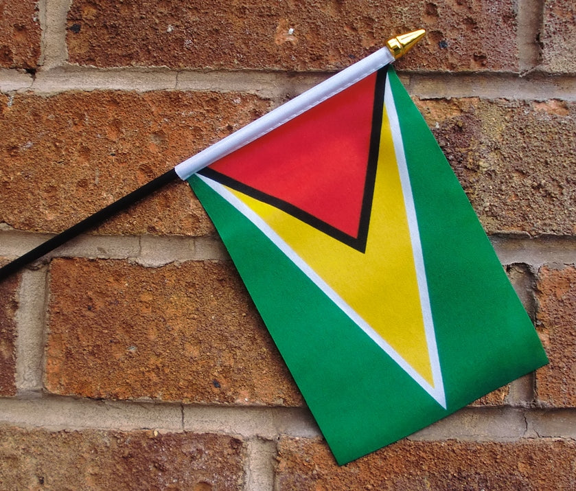 GUYANA SMALL HAND WAVING FLAG 6" X 4" WITH POLE